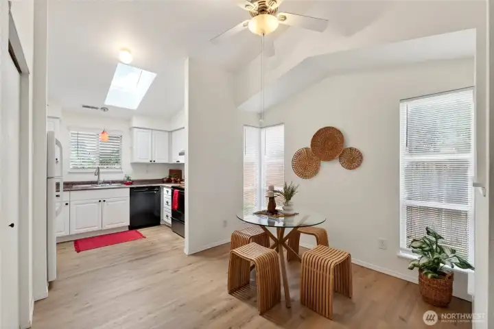 Charming and efficient kitchen makes great use of space and the dining area offers a distinctive architectural peak adding character and visual interest.