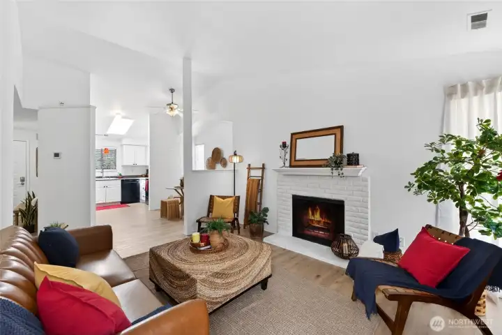 Enjoy the seamless look and feel of consistent flooring through the home, creating a cohesive flow from room to room.  Gather around the cozy wood-burning fireplace and enjoy it's warmth on our cool PNW Fall evenings.