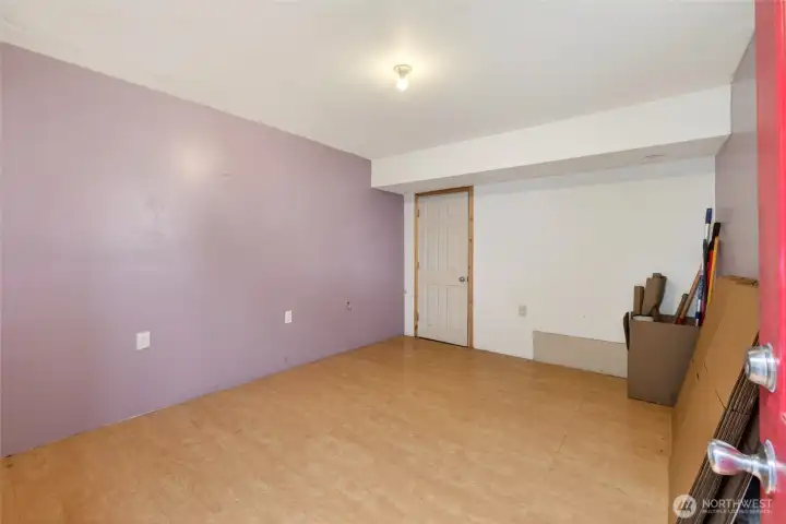This is the Flex room, previously the garage, which was converted before seller purchased.  A plethora of options depending on your living needs!  Through the door ahead, you'll enter into the small workshop