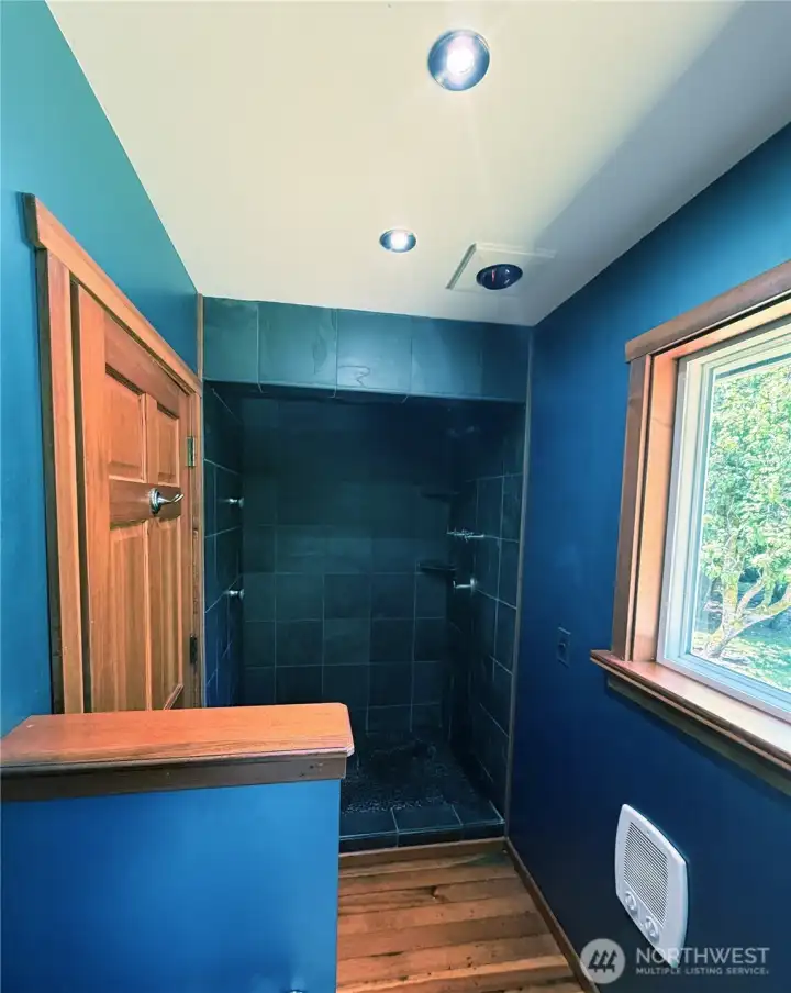The shower featuring a trio of rain shower heads The shower featuring a trio of rain shower heads