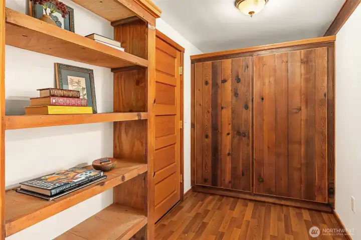 Gleaming built-ins frame the lower level foyer Gleaming built-ins frame the lower level foyer