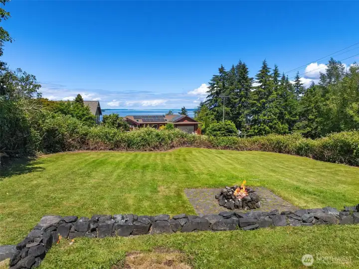 Rolling lawn showcases the view of the sound Rolling lawn showcases the view of the sound