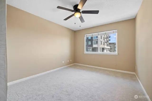 Bedroom with ceiling fan.