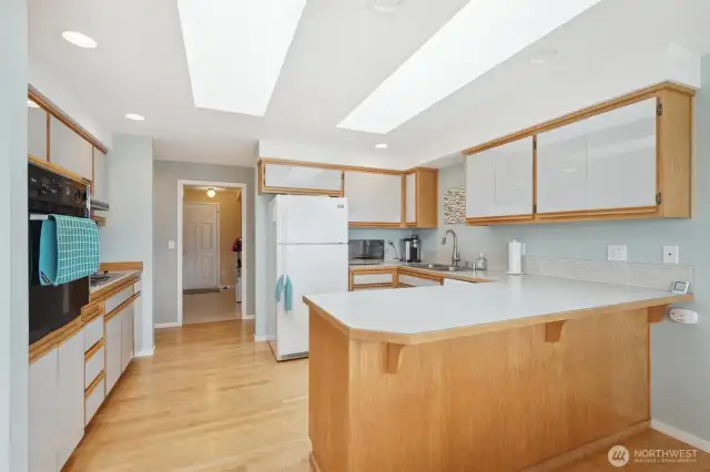 The large kitchen is open to the views and perfect for entertaining with the open concept dining room and access to the outside patio.