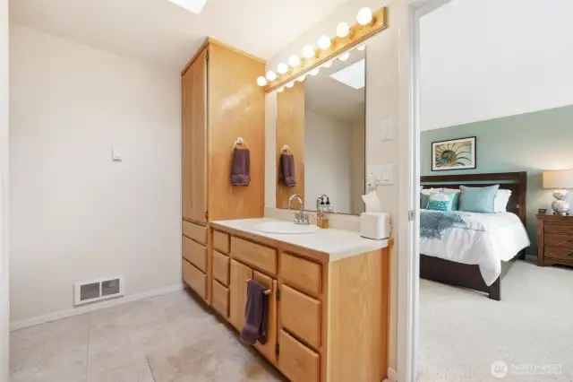 The primary bathroom complete with shower and bathtub.