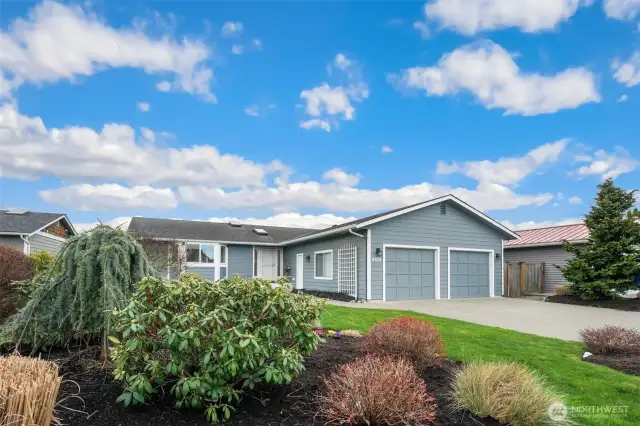 Beautiful established landscaping adds to the curb appeal.