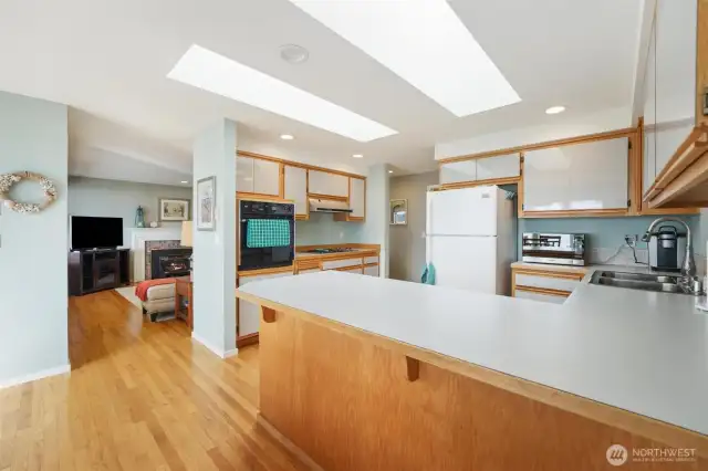 The large kitchen is open to the views and perfect for entertaining with the open concept dining room and access to the outside patio.