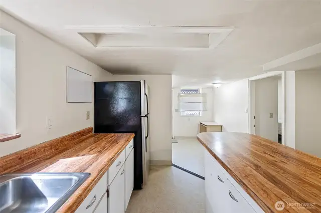 sink, fridge, dining space and storage.