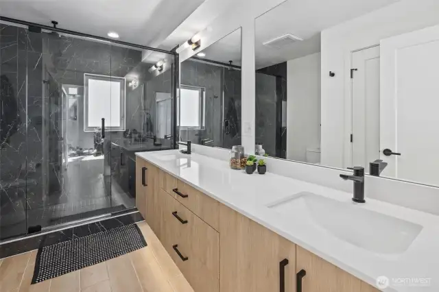 Primary bathroom suite with double sink floating vanity