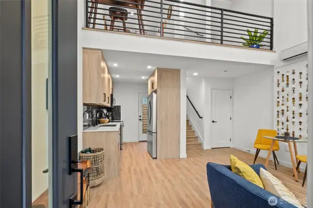The dramatic 2-story entry with loft overlooking the living area