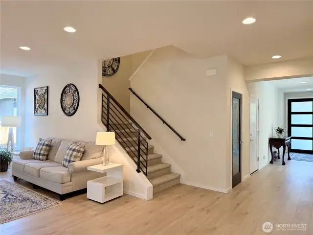 Looking at the great room staircase and front entry.