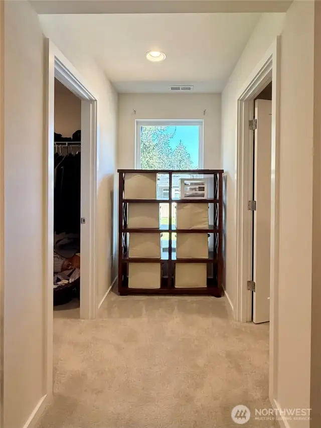 In the primary bedroom (4), leading to the spacious dressing rooms. The left walk-in closet is spacious. The walk-in closet on the right is much more spacious!