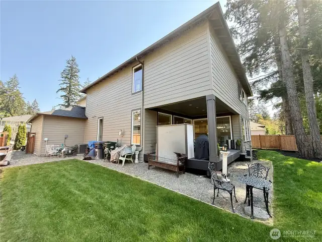 Garage side of home with nice-sized side-yard.