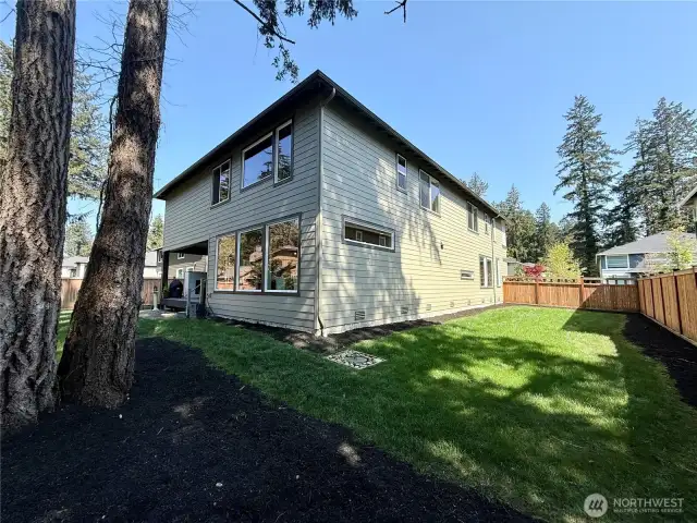 Other (kitchen/dining) side of home with nice-sized side-yard.