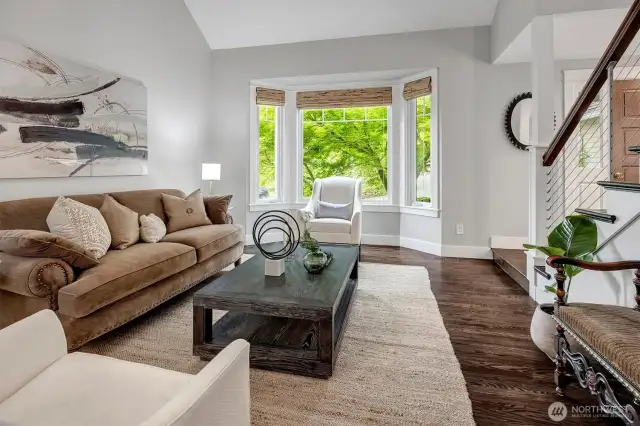 Living room with bay window & vaulted ceiling
