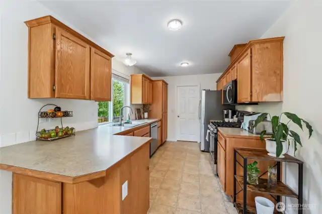 Kitchen has new dishwasher, microwave and range. Plenty of counter space for prep work.