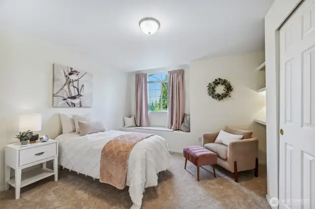 One of the two extra bedrooms upstairs is south facing and takes advantage of the beautiful sunsets. Window seat is perfect for enjoying them!
