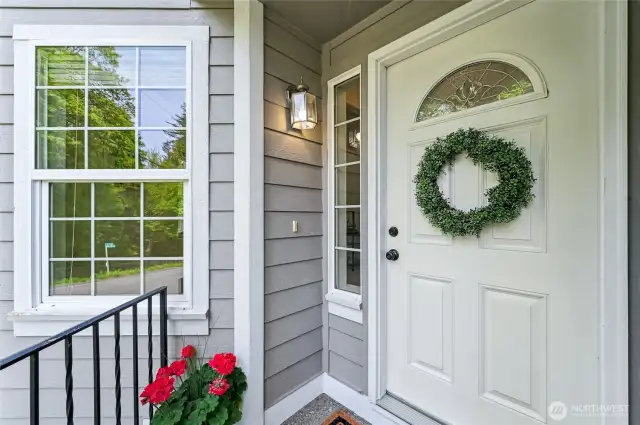 Inviting front door with landing is perfect to welcome guests to your home.