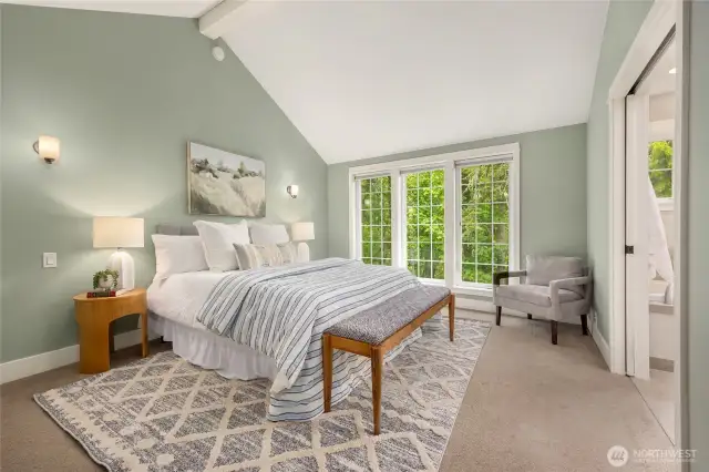The primary suite is bright and serene, with vaulted ceilings, a generous closet, and room to unwind.