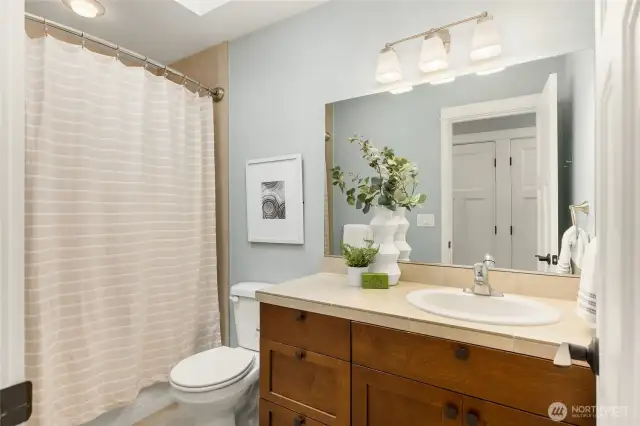 The upstairs hall bath is perfectly located to serve bedrooms and the bonus room.