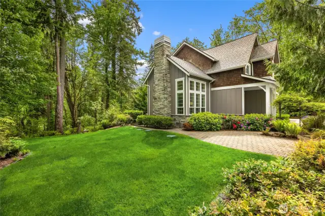 Side yard offers extra outdoor space for pets, play, or gardening.