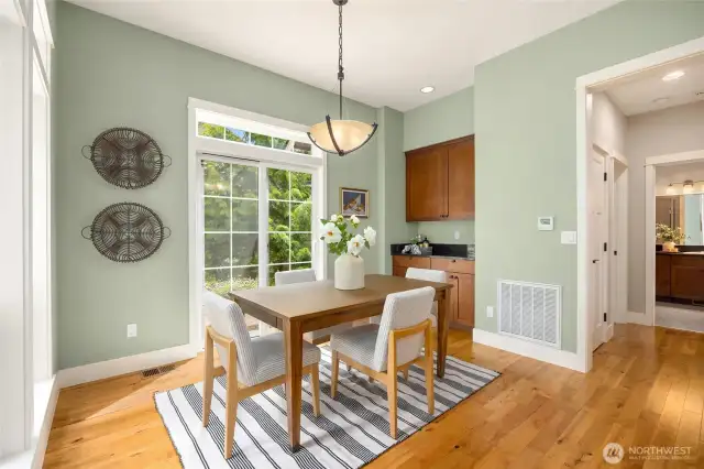 Sip your morning coffee while birdwatching from this peaceful garden-facing dining room.