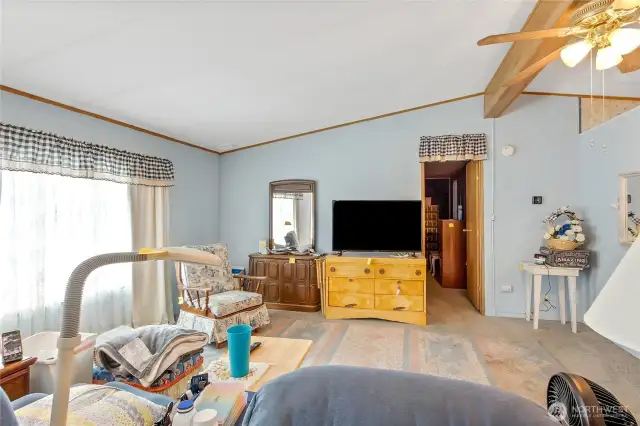Large front window in living room offers plenty of natural light