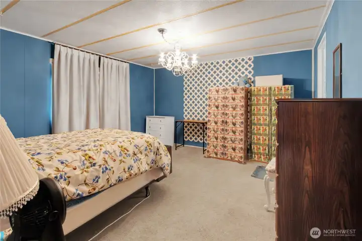 Primary bedroom with walk in closet and private bath