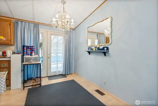 Dining area with french doors to covered back deck