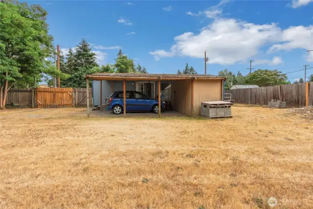 Carport integrated with the shed and covered deck