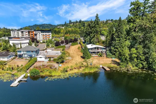 Gentle slope to towards the lake, vacant waterfront lot is 16,137sf.