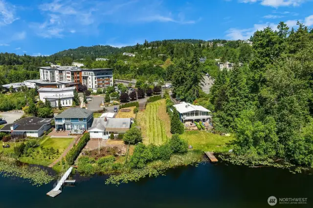 Gentle slope to towards the lake, vacant waterfront lot is 16,137sf.