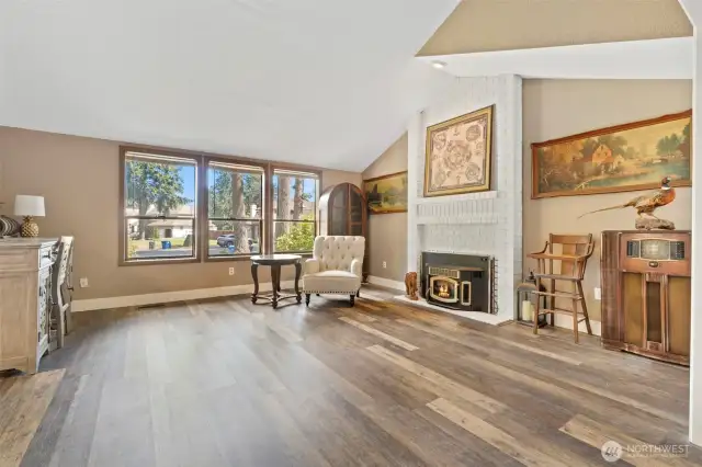 Just off the foyer, a formal living room offers a versatile space ideal for entertaining or relaxing.