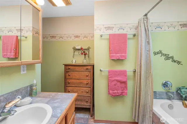 Well lit primary bath with jetted tub