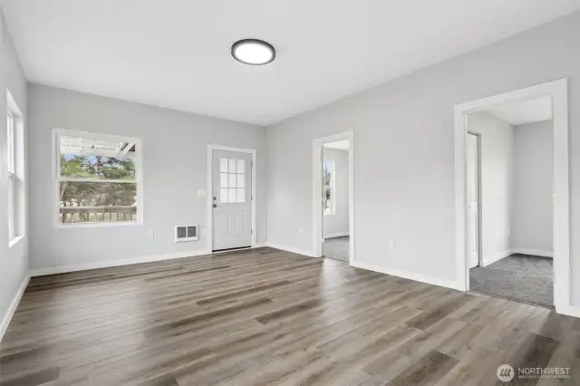 Another view inside the front door. Doors to two bedrooms or an office/hobby room.