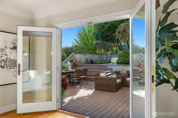 These french doors open to the back patio-  just to the right of this door is the hallway to the kitchen - amazing circular flow for entertaining.