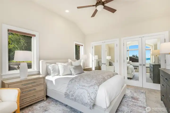 The Primary bedroom suite was an addition and features vaulted ceilings, lots of windows overlooking the back yard and the view, and a whole wall of closets with mirrors to reflect the view and light.