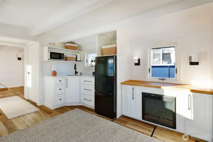 Electric fireplace and nice built in storage.