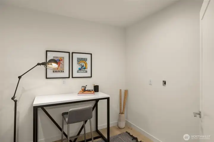 Optimize productivity in this cozy, private workspace, ideal for focused work or study, with contemporary decor and ample lighting. Photos of home with similar layout, finishes & fixtures.