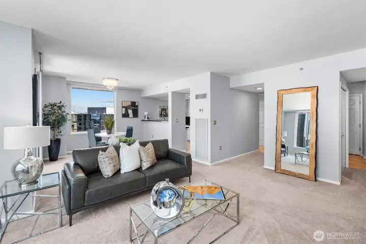 A spacious and elegant living room in the heart of downtown Bellevue, perfect for both relaxing and entertaining.