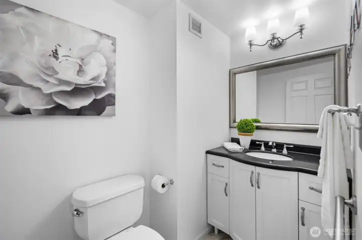 Half BaA stylish and convenient half bathroom located for easy access for guests, complete with a modern vanity and sink.th