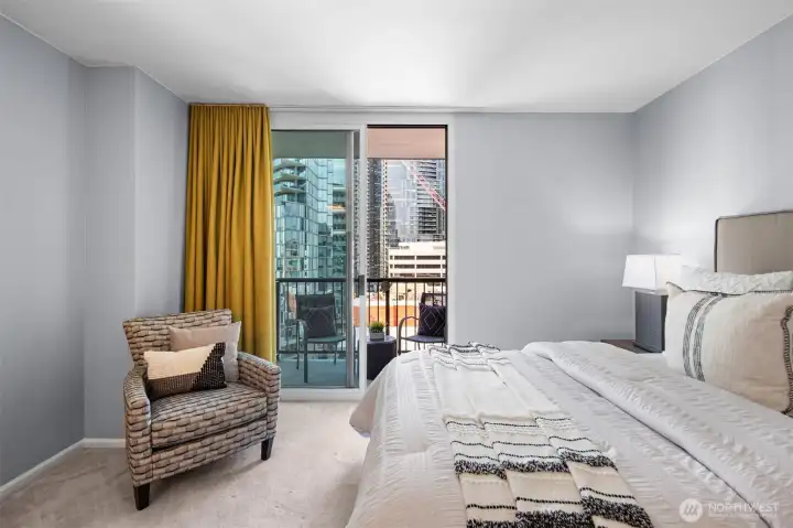 The well-appointed primary suite offers a large, private space with customized closet designs for optimal organization.