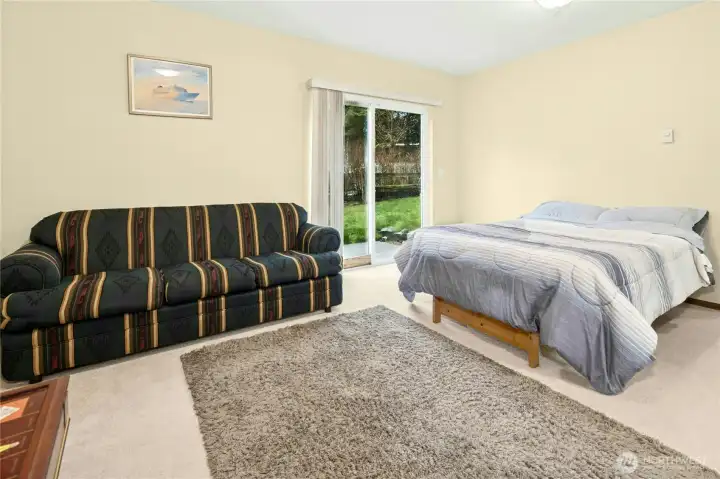 Main-level bedroom with attached full bath — ideal for guests, multi-generational living, or private office space.