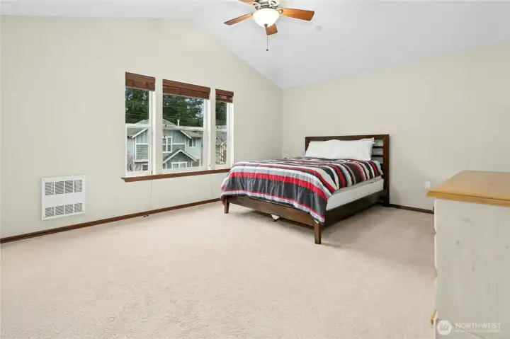 Spacious primary suite designed for comfort and privacy.