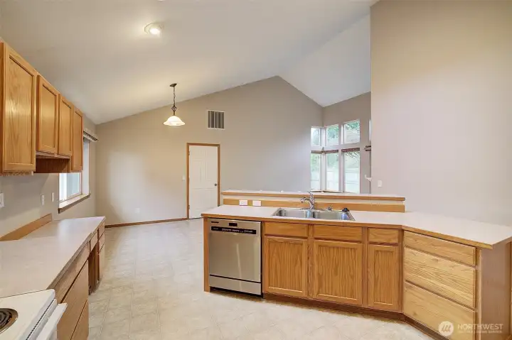 enjoy the open dining area and family room off the kitchen. The door leads to the 2 car garage.
