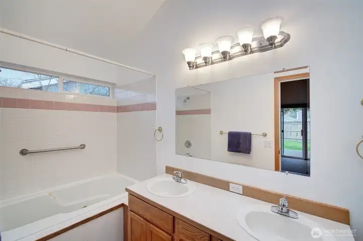 En-suite bath with large tub/shower and double sink