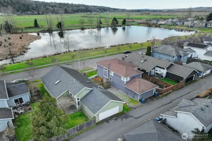 2 car garage with alley access. Fenced backyard with private patio and wisteria.