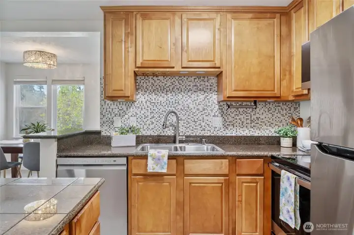 Kitchen features new stainless appliances.
