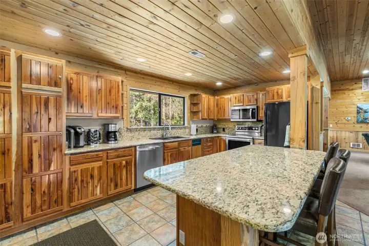 Spacious kitchen featuring granite countertops