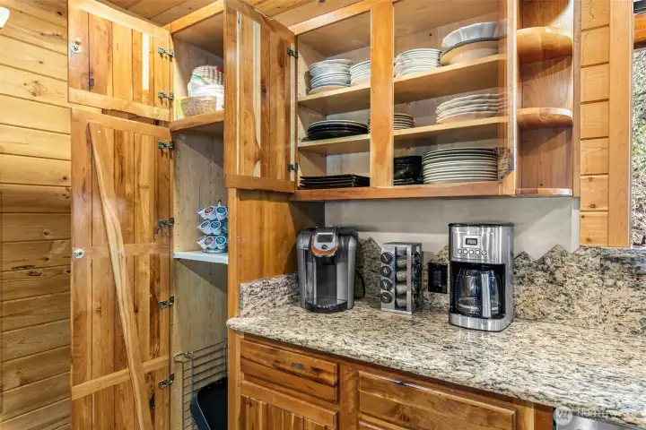 Ample countertops, cabinetry, and a large island with bar seating—ideal for entertaining and group gatherings